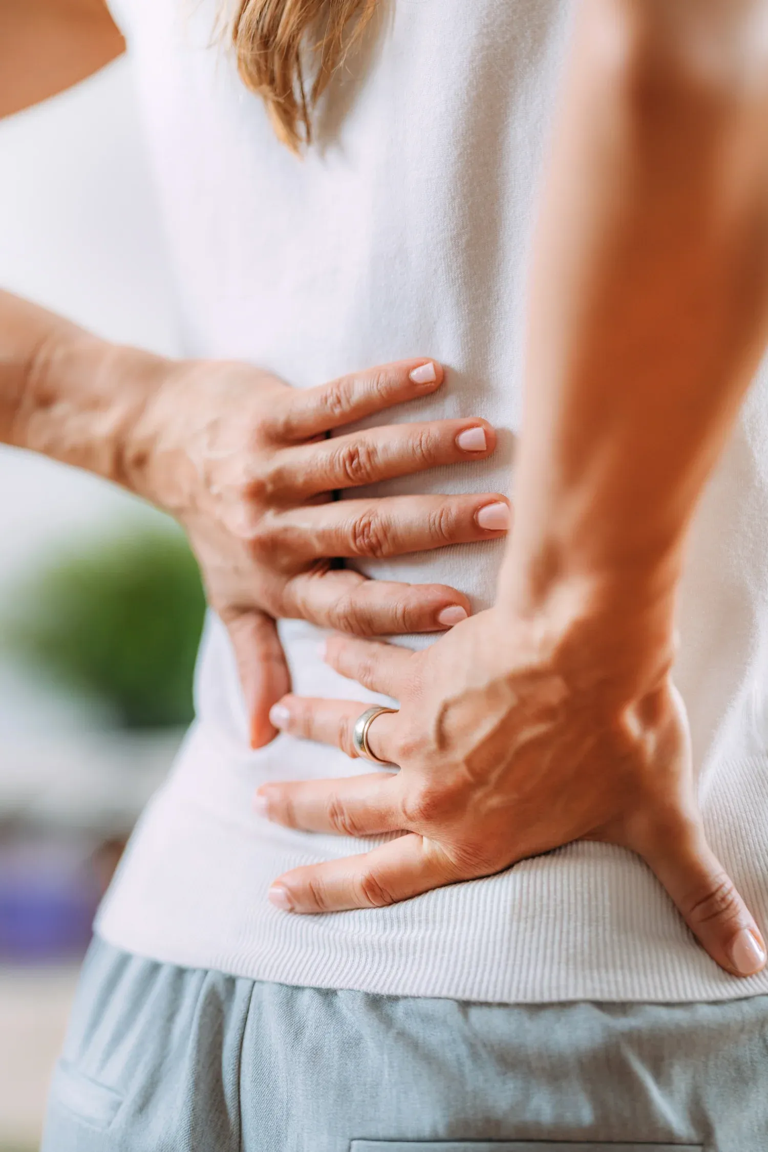 Person concerned about sciatic nerve pain at Bensa Chiropractic and Wellness