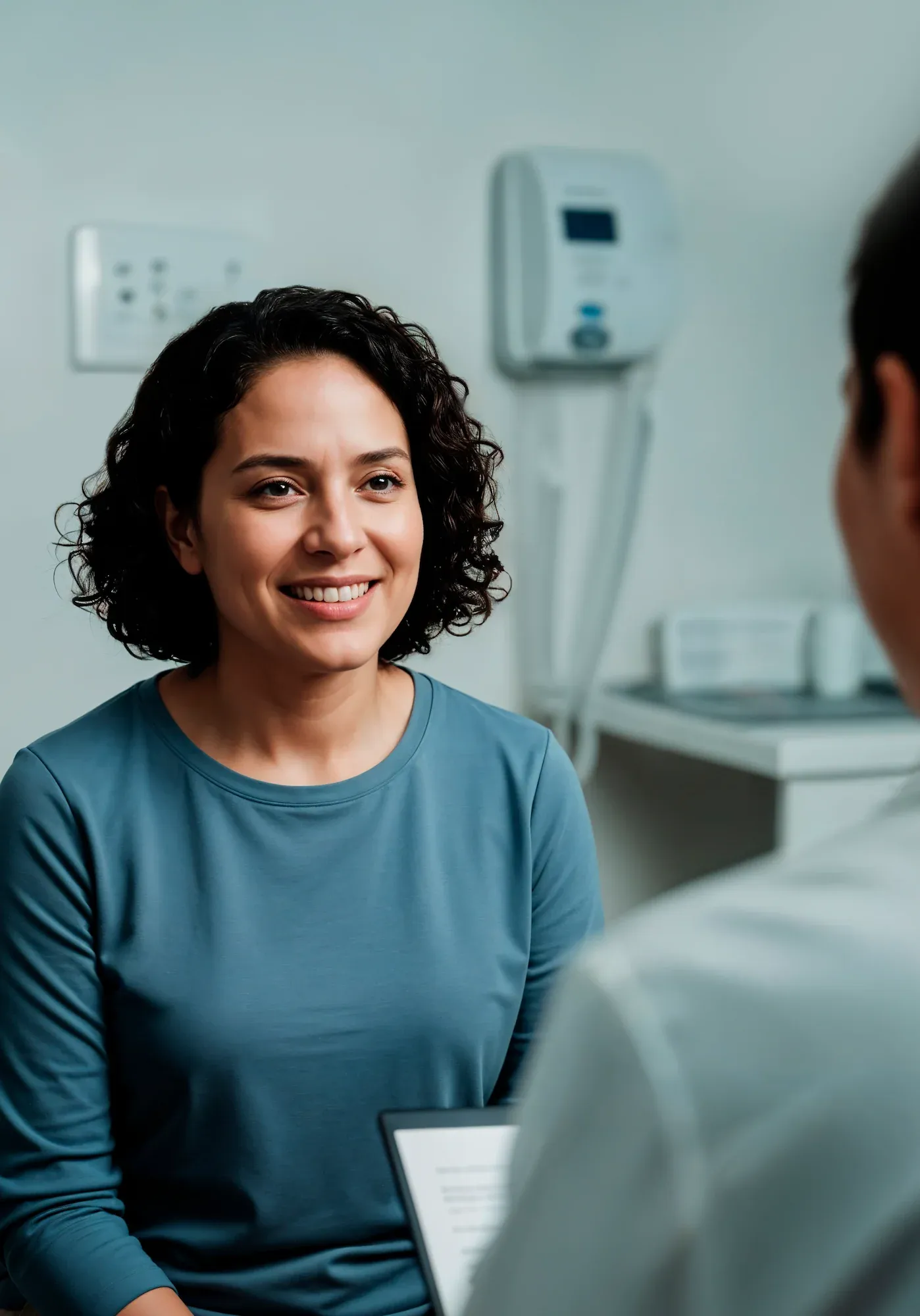 Patient consulting with Dr. Korman about whole body vibration benefits