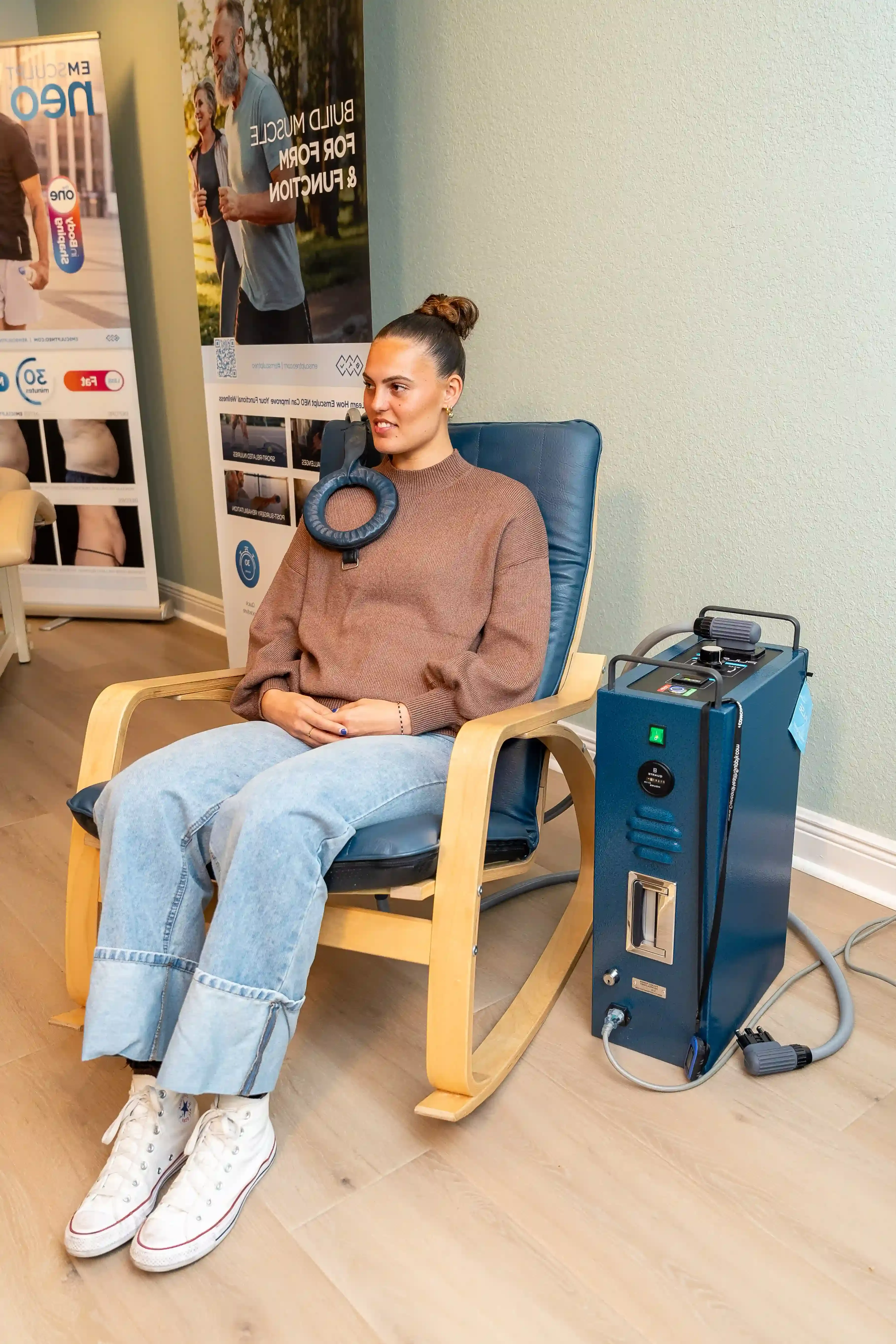 Confident patient ready for PEMF therapy consultation at Arise Integrative Wellness