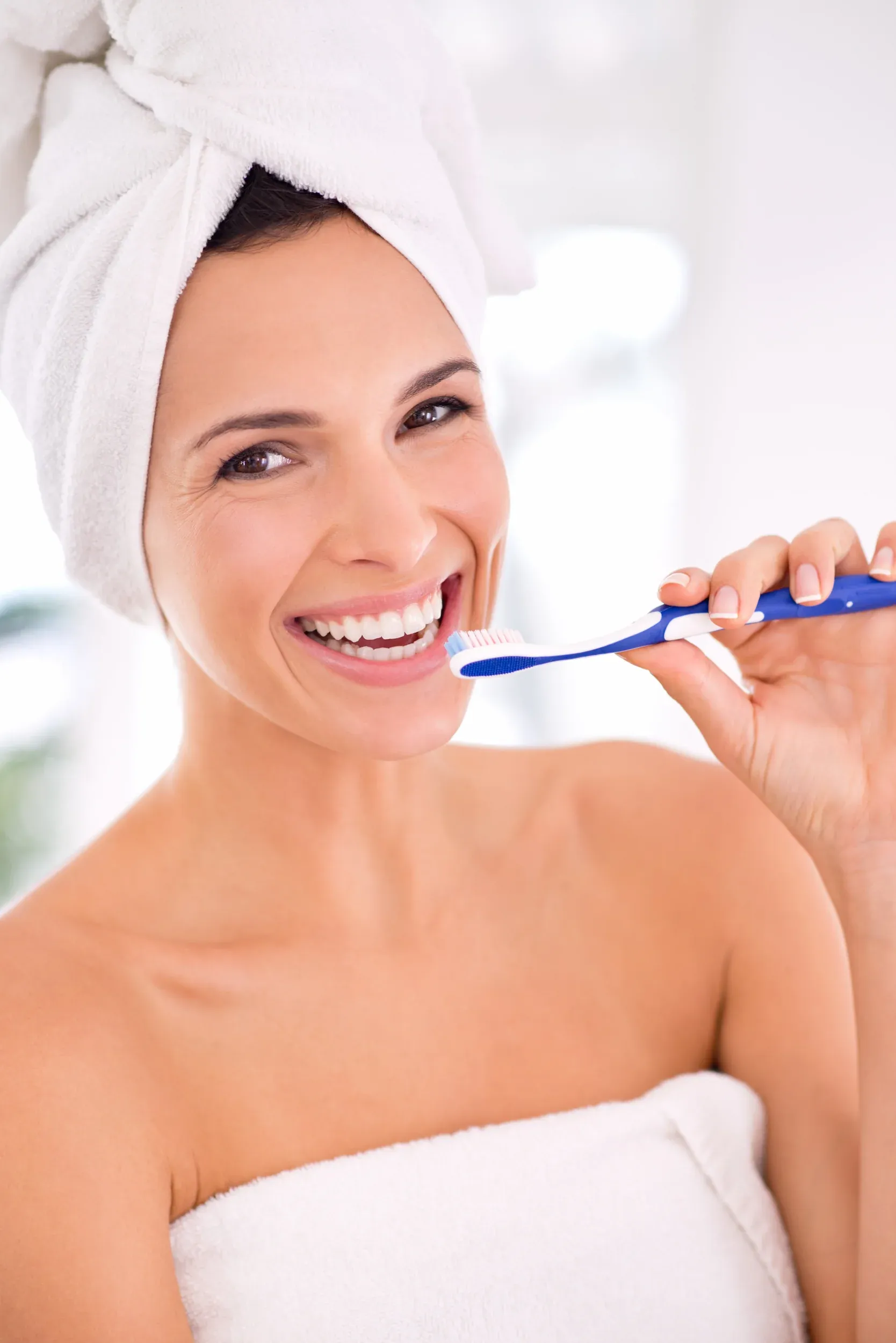 Patient smiling after professional teeth cleaning at Enclave Dental Lake Mary
