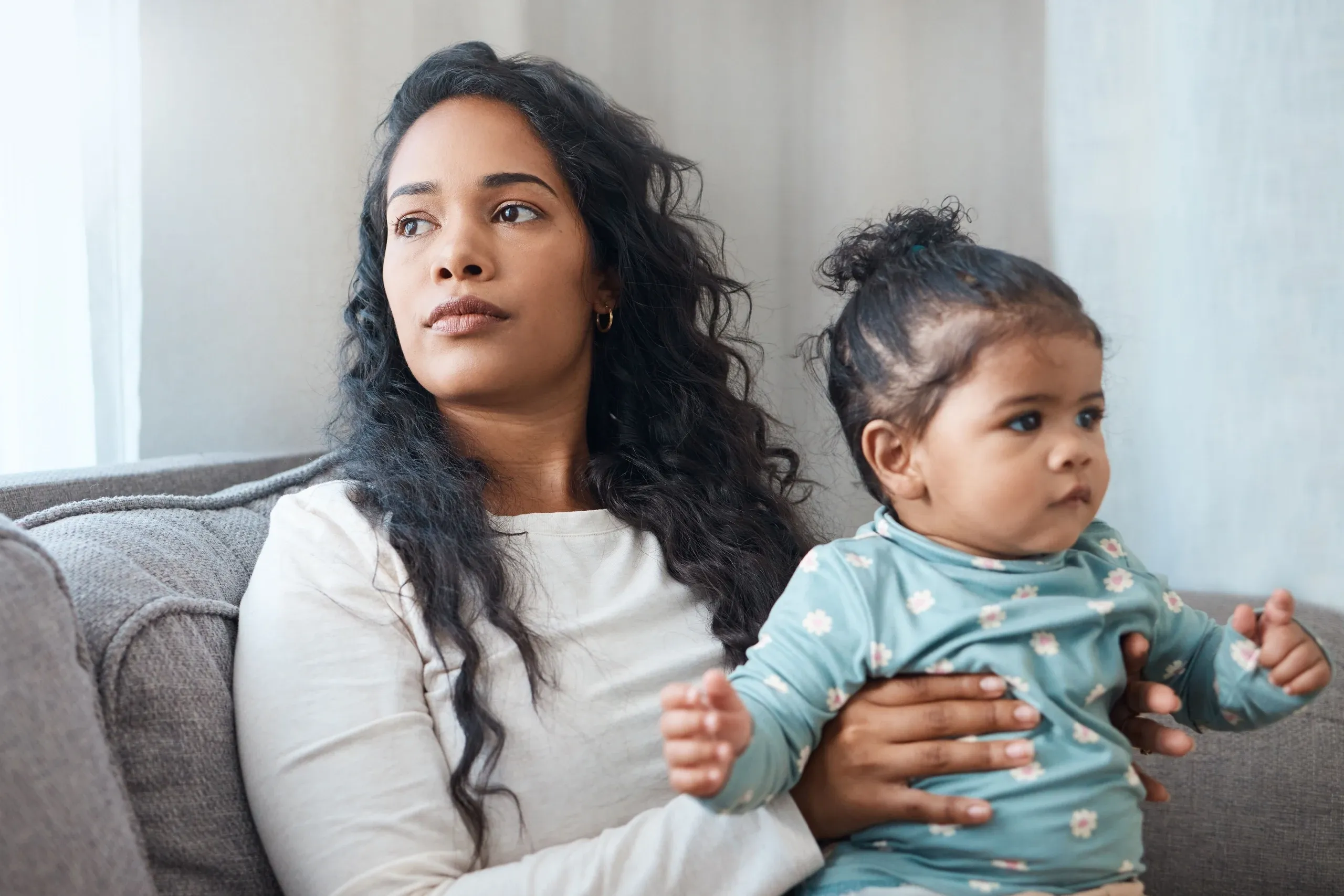 Healthcare provider assessing postpartum depression risk factors with expectant mother