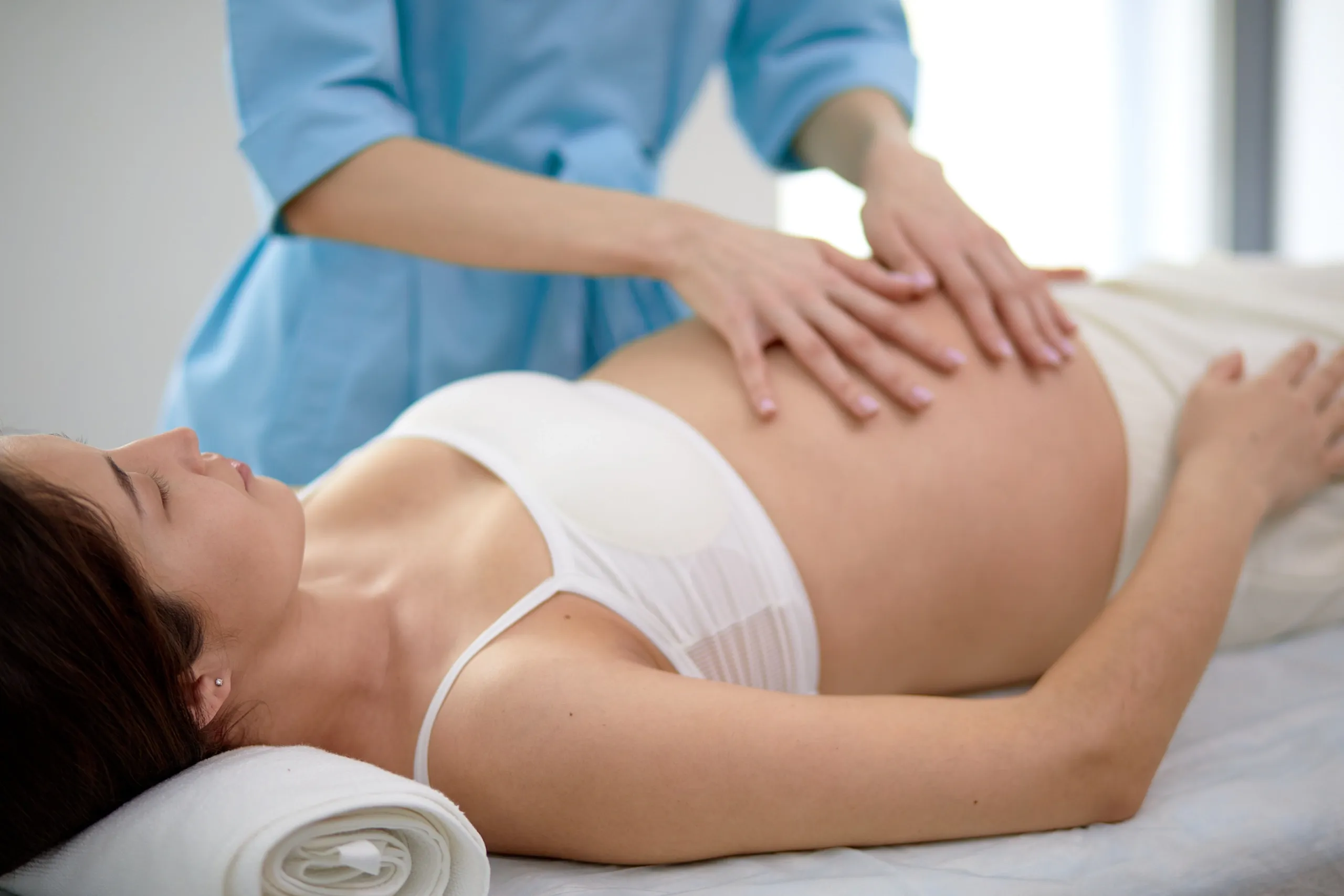 Expecting mother consulting about prenatal chiropractic benefits at Precision Chiropractic Rockford