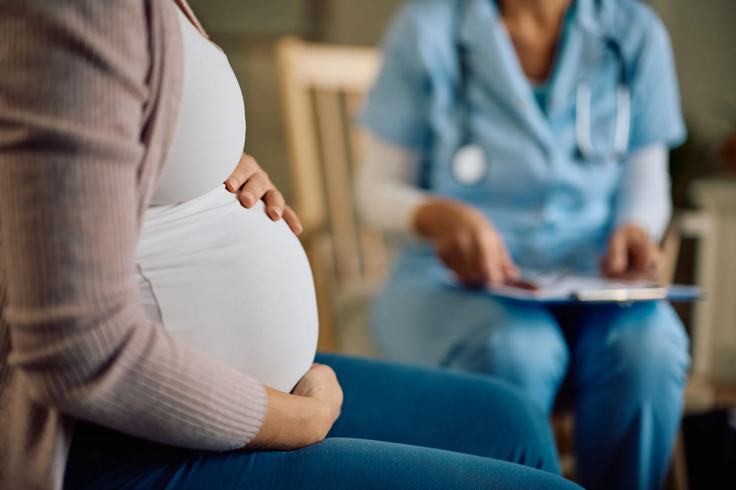 Pregnant patient receiving a prenatal chiropractic adjustment for pelvic alignment in Alma, GA