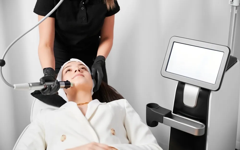 Patient consultation discussing RF Microneedling benefits