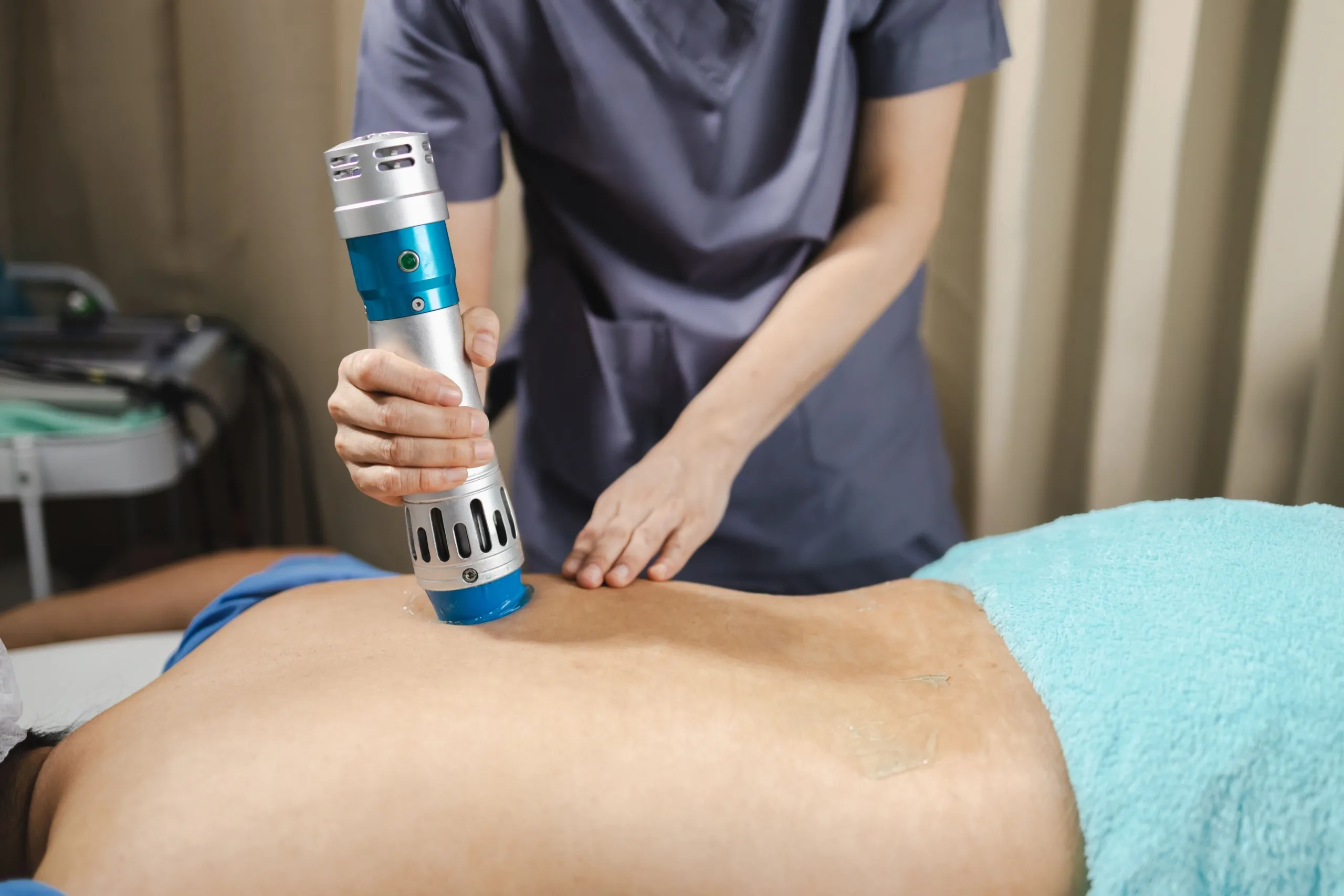 Patient receiving shockwave therapy treatment at Bensa Chiropractic and Wellness in Bradenton FL