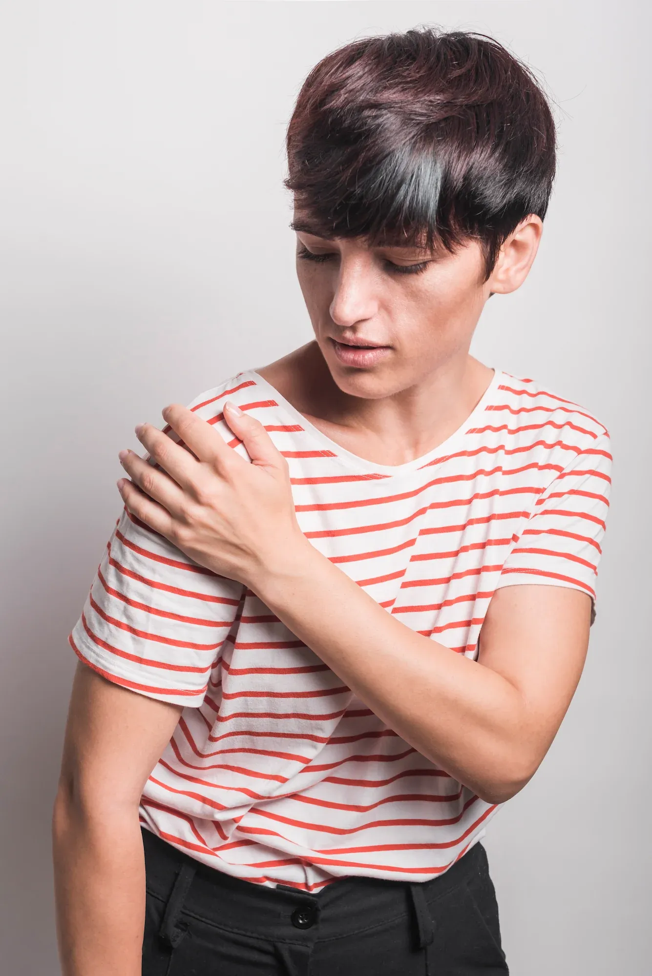 Close-up of a person experiencing shoulder pain at Reliance Primary & Urgent Care