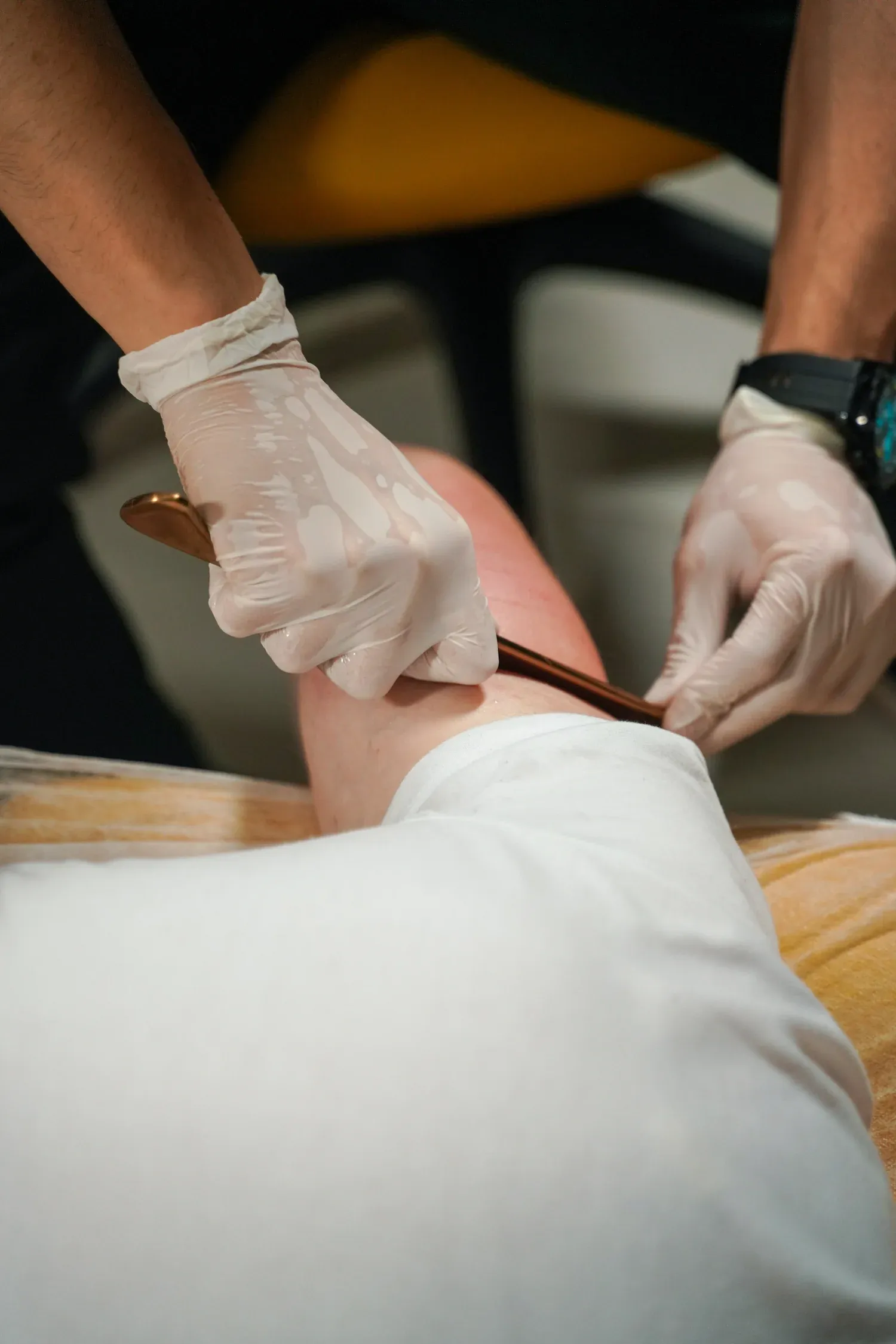 Patient consulting with chiropractor about IASTM benefits at Bensa Chiropractic Bradenton