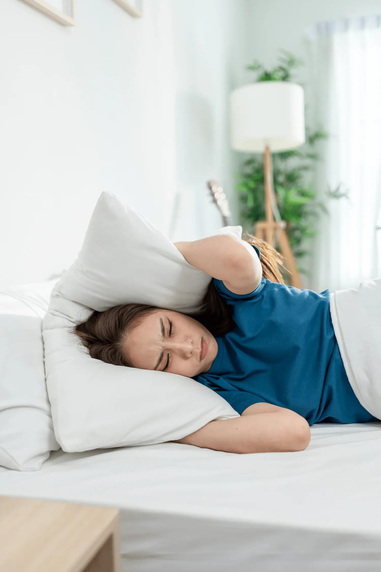 Person concerned about chronic sleep problems at Arise Integrative Wellness