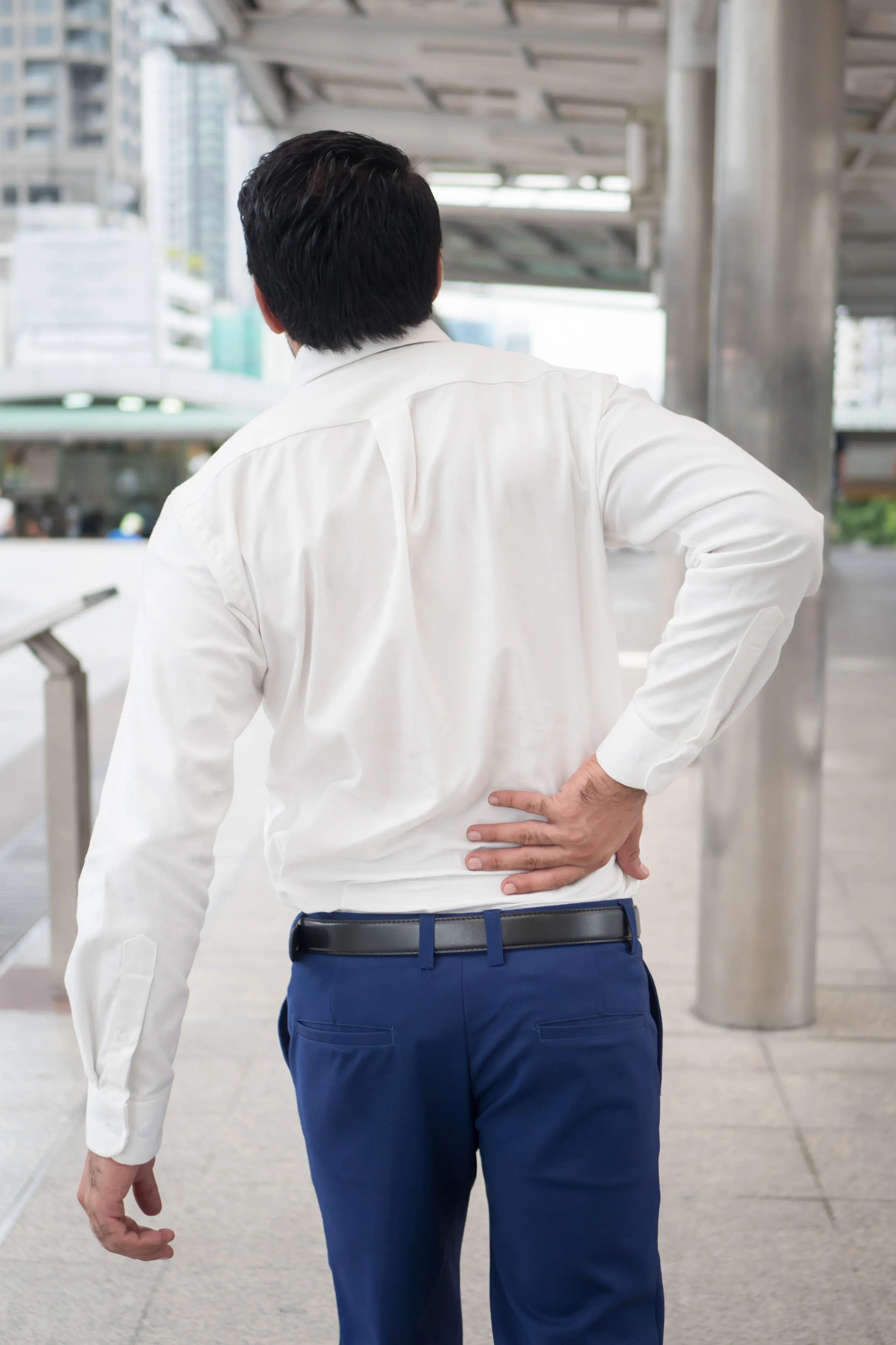 Person concerned about back and leg pain at Bensa Chiropractic and Wellness