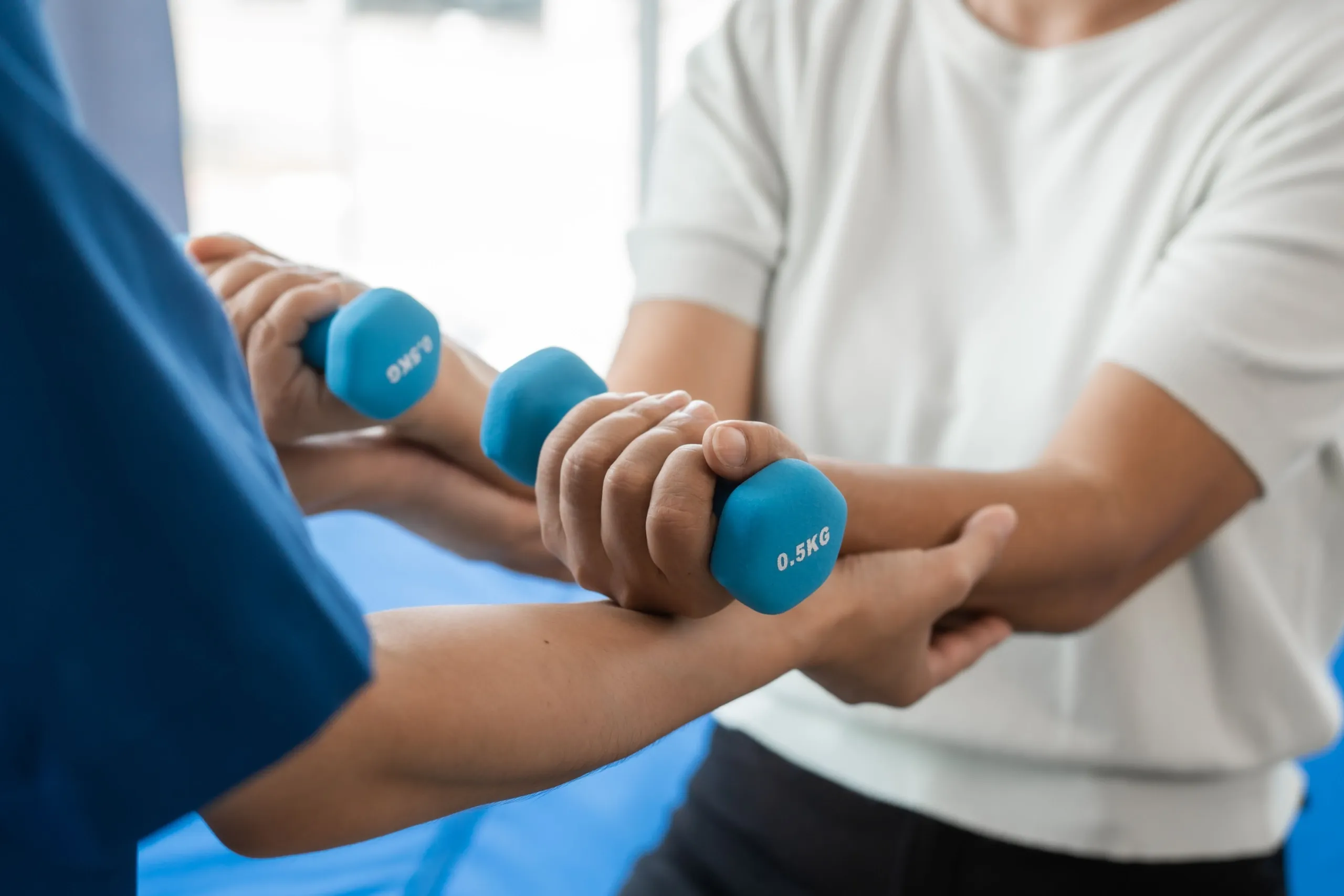 Sports chiropractor treating athletic injury at Roots Chiropractic in Alma, GA
