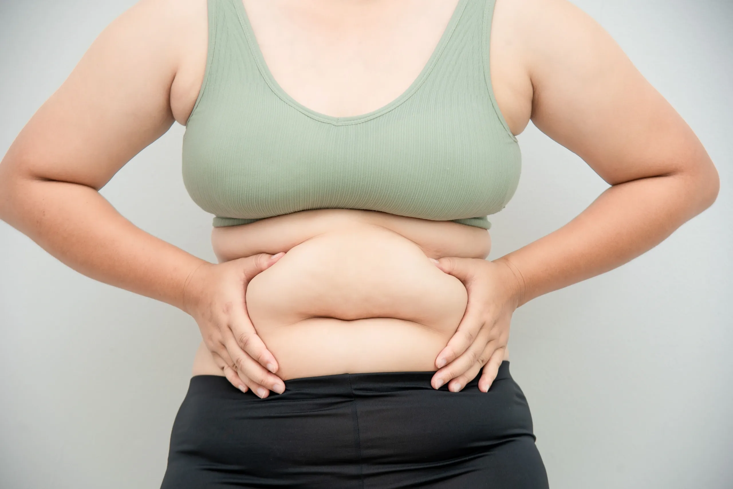 Patient evaluating stubborn fat concerns at Hartley Health and Wellness Canton GA