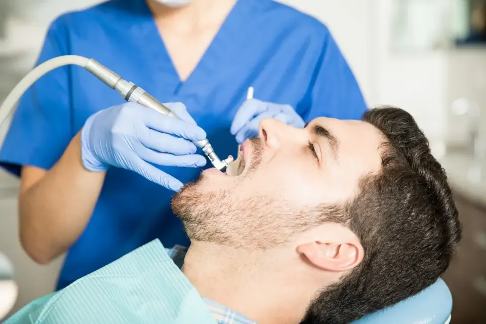 Patient smiling after a professional teeth cleaning at Cook Family Dentistry