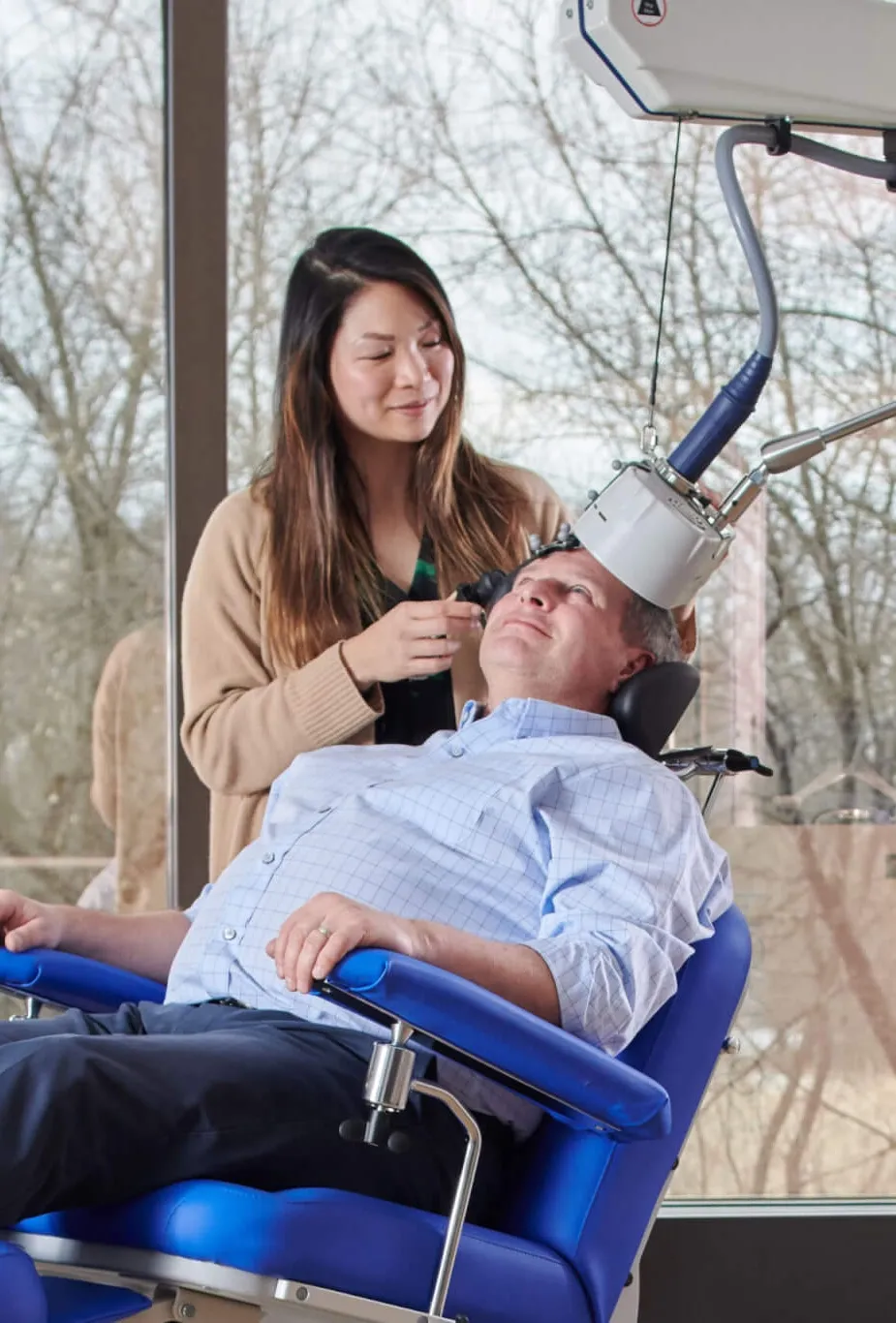 Patient receiving TMS therapy for depression at R&C Psychiatry Pembroke Pines FL