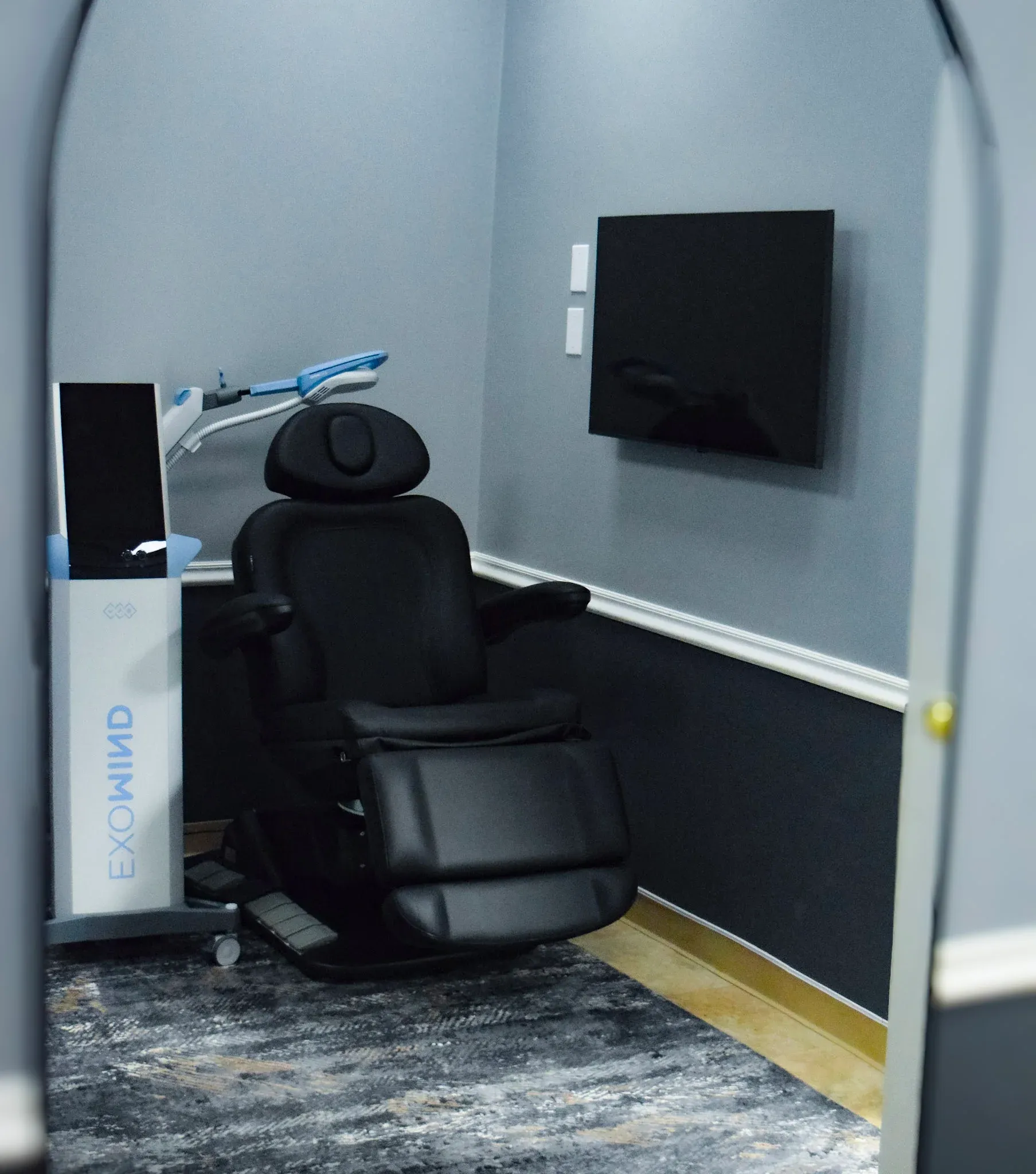Exomind TMS device positioned for cognitive wellness session at Heritage Wellness