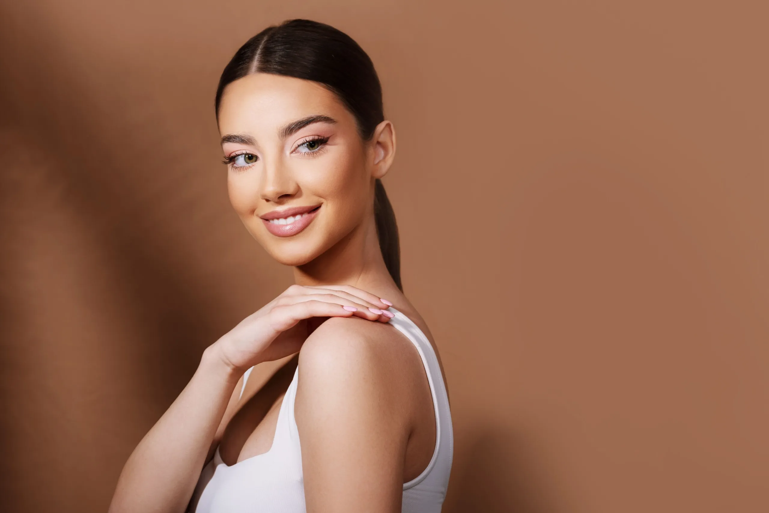 Person considering professional hair removal options at Eternal Wellness Medical Spa Traverse City