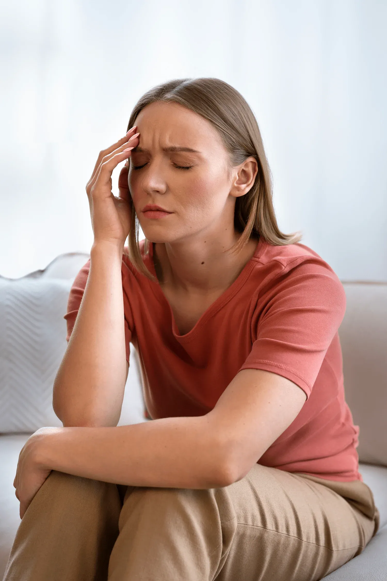 Person concerned about chronic migraines at Arise Integrative Wellness