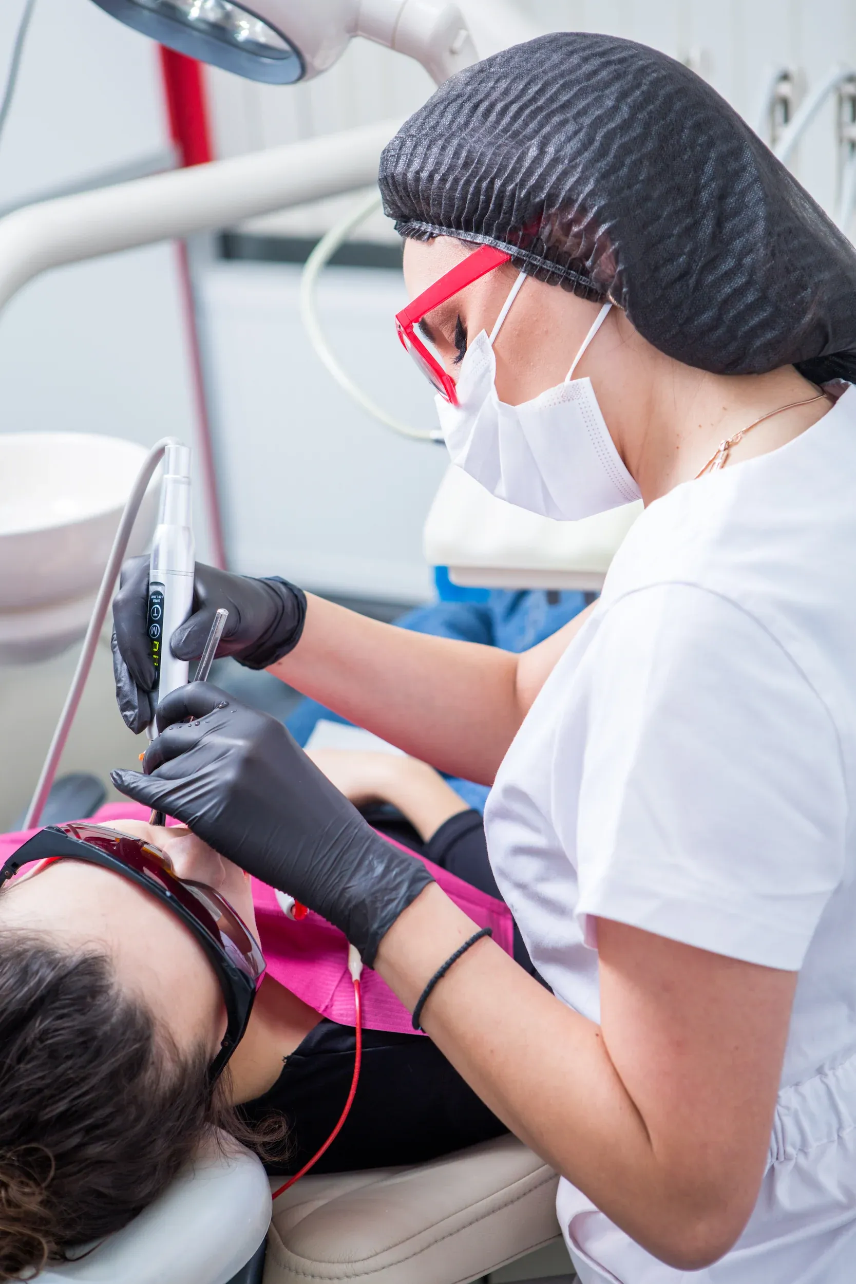 Person experiencing jaw pain from teeth grinding at Dental World Longwood
