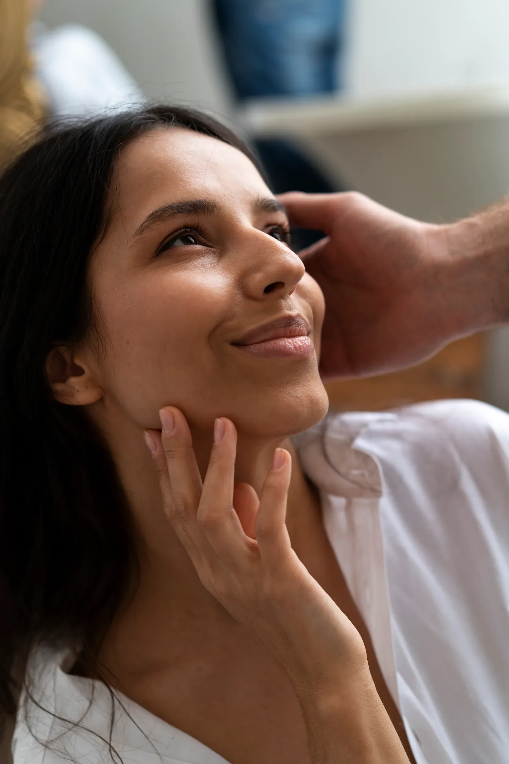 Person concerned about facial volume loss at Mint Aesthetics & Skin
