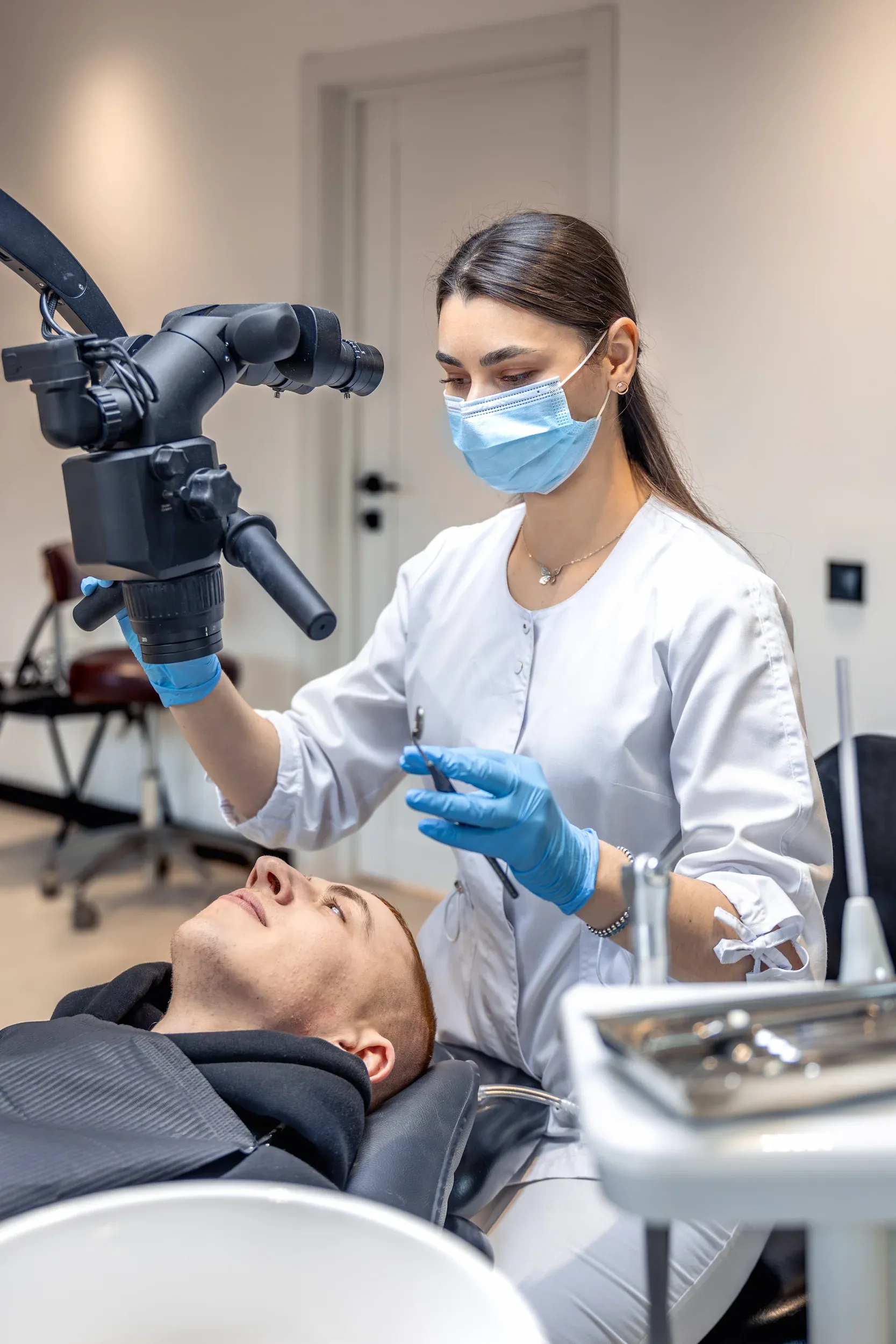 Patient and hygienist during dental cleaning consultation at Dental World Longwood