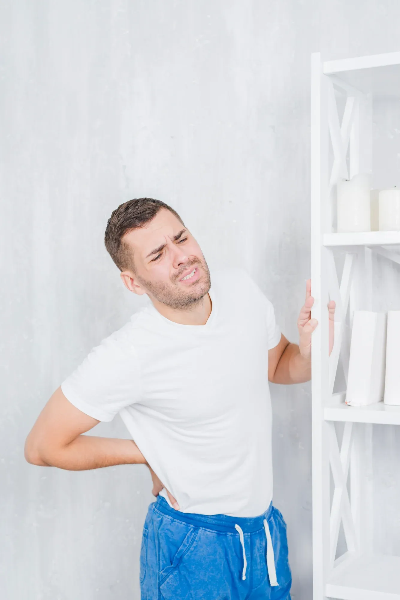 Patient concerned about back pain symptoms at Roots Chiropractic